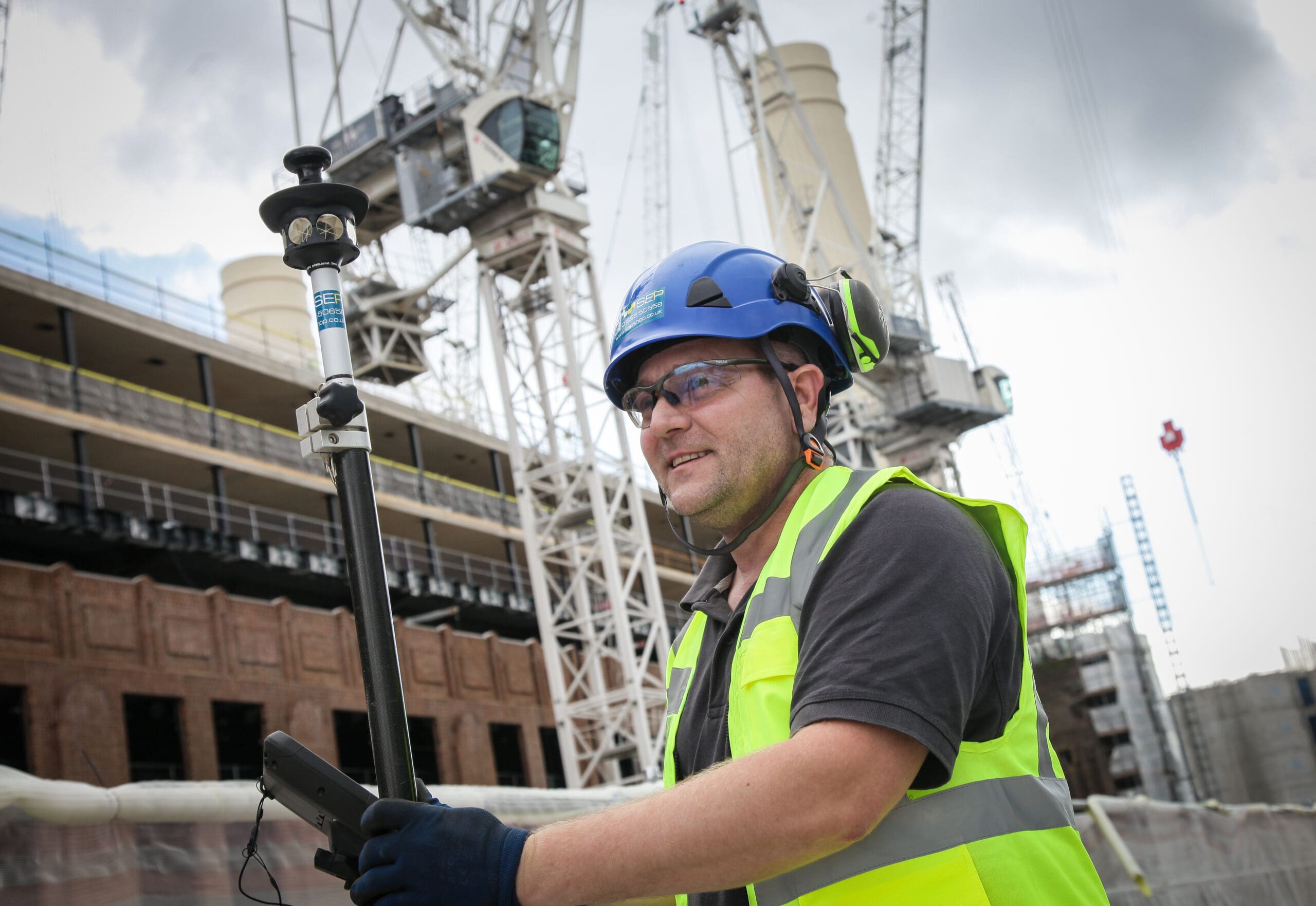 Setting out engineer marking site in Barnet